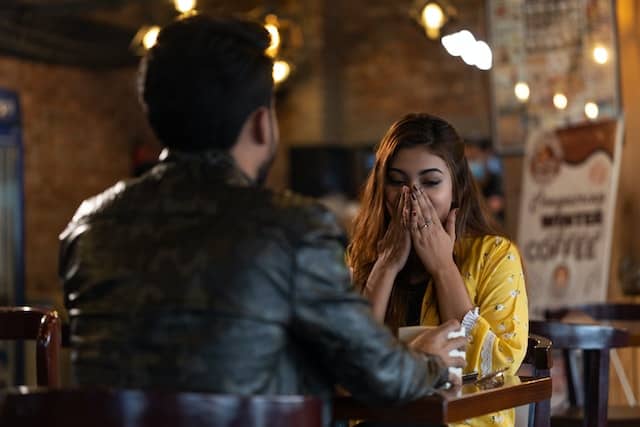 Woman surprised on a date in café