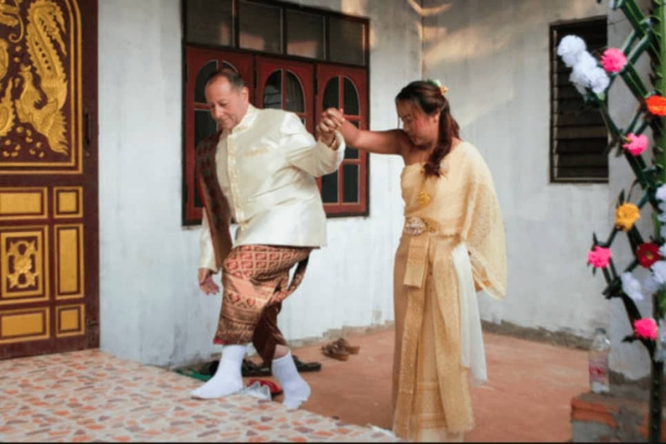 Eastern couple walking together holding hands